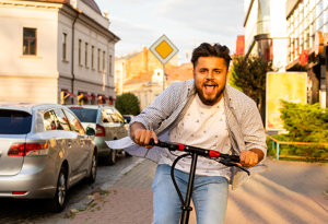 Man Riding Electric Scooter