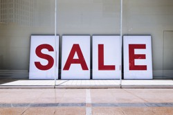 Sale poster in window