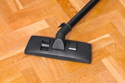 Vacuuming wooden floor
