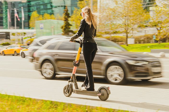 Girl travelling on scooter