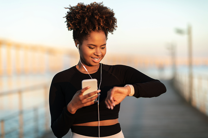 Woman looking at fitness tracker