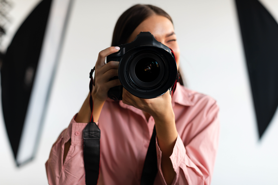 Woman with DSLR camera